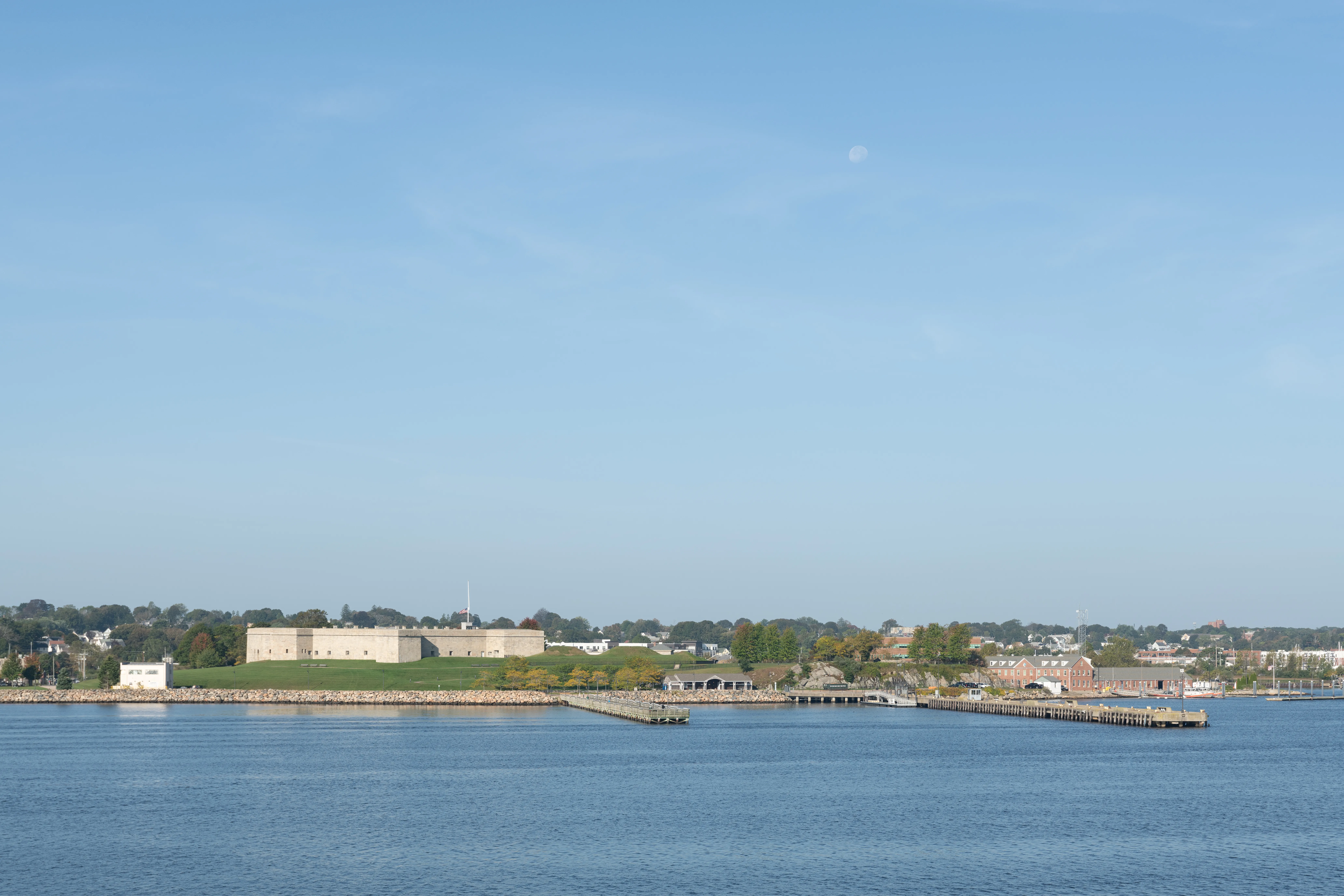 Fort Trumbull State Park on the Thames River in New London, Connecticut, seen from the water, with its granite walls and public fishing pier.